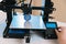 New generation of 3D printing machines printing a plastic part. For use in small spaces, offices or private use