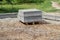 New gray curbs are stacked on a wooden pallet. Curbs are used as