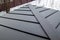 new grey folded metal roof of modern cottage viewed from above