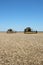 New Holland combine in wheat field ready to work, harvest in summer