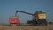 New Holland CX8080 on a field in sunny summer day France, Brittany region 25 August 2021. Yellow combine harvest on