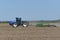 New Holland T9020 Tractor pulling a John Deere 2210  Folding Field Cultivator