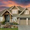 New Home House Exterior Grand Custom Brown Stucco Dwelling Double Garage Sunset