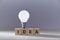 New idea generation. Insight and creative thinking. Perfect brainchild. Wooden cubes with inscription and lightbulb