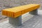 New infrastructure object in the city- wooden bench with concrete legs