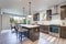 New kitchen boasts dark wood cabinets, large island