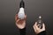 New LED lamp and incandescent lamp in women's hands. the concept of energy saving.