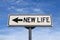 New life road sign, arrow on blue sky background