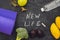 New life is written on chalk board. New life concept