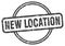 new location stamp. new location round vintage grunge label.