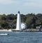 New London Lighthouse with motor boat moving in front