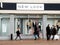 New Look shopfront with people,blurred, walking past