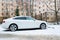 New luxury Audi A5 Sportback parked in winter street.