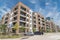 New luxury multistorey apartment community with parked cars near Dallas, Texas