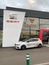 New luxury sport Seat Cupra car in front of new dealership