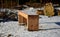 New massive benches in the woods on a lookout of larch wooden beams. screwed and fixed to the ground. sunken with snow. view from