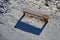 New massive benches in the woods on a lookout of larch wooden beams. screwed and fixed to the ground. sunken with snow. view from