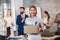 New member of team, newcomer, applauding to female employee, congratulating office worker