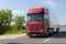 New Mercedes Actros truck in beautiful red colour. Mercedes Actros with trailer in motion