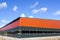 New metal frame factory building, covered with sandwich panels against a blue sky
