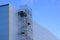 New metal frame factory building, covered with sandwich panels against a blue sky