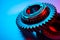 New metal gears spare parts for gearbox in two colors red and blue. Conceptual image of the mechanical elements of the