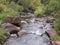 New Mexico hillside waterfalls stream whitewater river rocks wet water