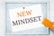 New mindset text on notice board with pencils