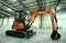 New model of mini backhoe parked on a stand