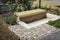 New modern bench and sitting area in patio, garden or terrace with plants