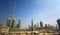 New modern building in construction and Burj Khalifa, Dubai