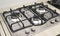 New modern gas stove with four burners for the kitchen, stainless steel surface