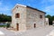 New modern Mediterranean villa built in traditional stone style surrounded with decorative gravel and stone tiles next to fresh