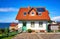 New modern single family house with red roof tiles and solar panels. Living overlooking the Baltic Sea on the island of RÃ¼gen