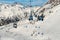 New modern spacious big cabin ski lift gondola pillar against snowcapped mountain peaks covered in snow landscape in luxury