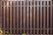 New modern wooden fence dark brown color