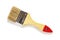 New natural bristle paint brush with red tip wooden handle isolated on white background. Design element for construction painting