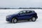 New Nissan Qashqai 2019 model color ink blue in snowy winter landscape.