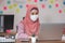 New normal of Asian business Muslim or islam women wearing face protective mask in casual working with laptop