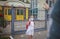 New normal back to school. Father passing her daughter in medical mask a sanitizer. Stay safe