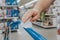 New normal. Closeup of man hand cleaning shopping cart handle with disinfecting wet wipe. Precaution against virus spread. COVID-