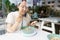New normal Middle-aged Asian woman Eating food with a plastic plate to prevent the spread of the virus. Social distancing and and