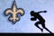 New Orleans Saints. Silhouette of professional american football player. Logo of NFL club in background, edit space