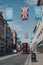 New Oxford Street, London, UK, decorated with Thank You banners and Union Jack flags, bus driving under