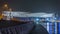 New pedestrian bridge over the Dubai Water Canal illuminated at night timelapse. United Arab Emirates, Middle East