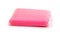 New pink kitchen sponge on white background.