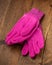 New Pink Purple Gardening Gloves on wooden background gardening concept