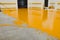 New polished concrete floor covered with a layer of yellow epoxy resin