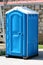 New portable ecological toilet or portable chemical toilet mounted on strong plastic foundation at local construction site