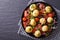 New potatoes with bacon, onion and tomato horizontal top view